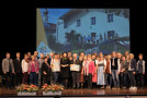 Gruppenbild der Silbergewinner aus Asten auf der Bühne mit Staatsministerin Michaela Kaniber
